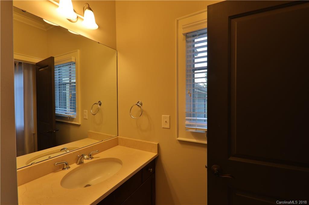 3715 Churchill Road Charlotte, NC 28211 - Photo 13 of 19 a bathroom with a sink and a mirror