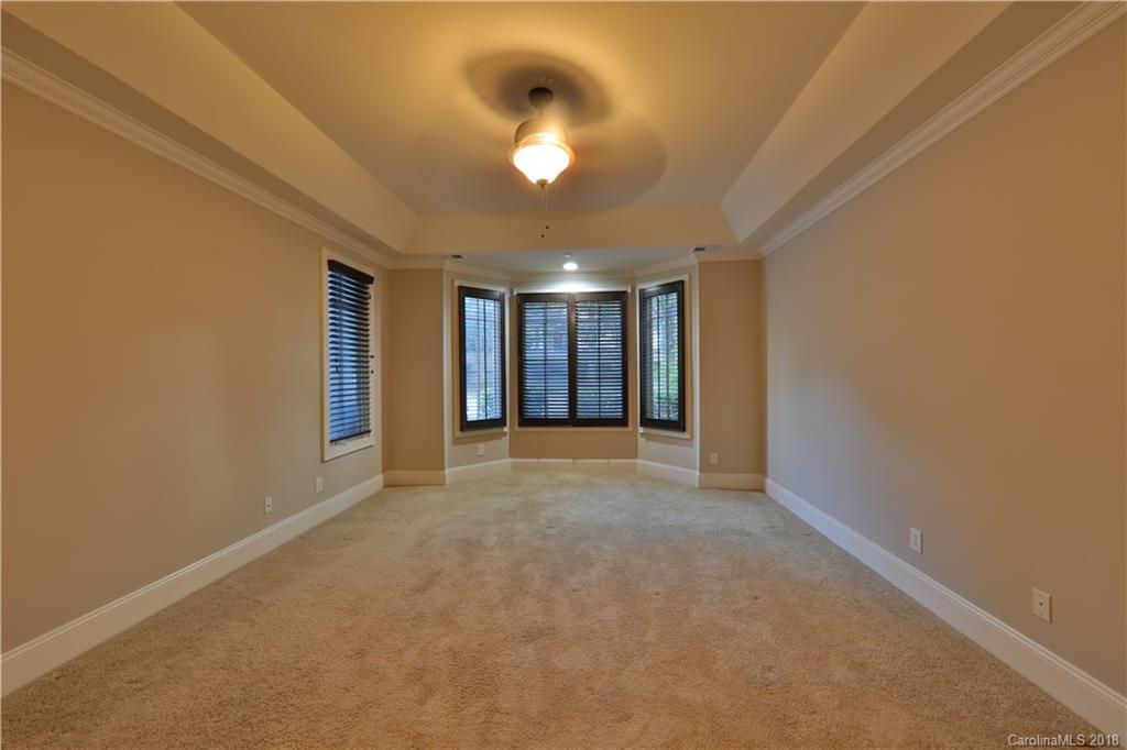 3715 Churchill Road Charlotte, NC 28211 - Photo 8 of 19 a view of an empty room with a chandelier fan