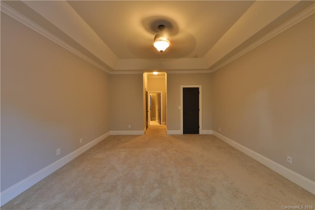 3715 Churchill Road Charlotte, NC 28211 - Photo 10 of 19 an empty room with a ceiling fan and window