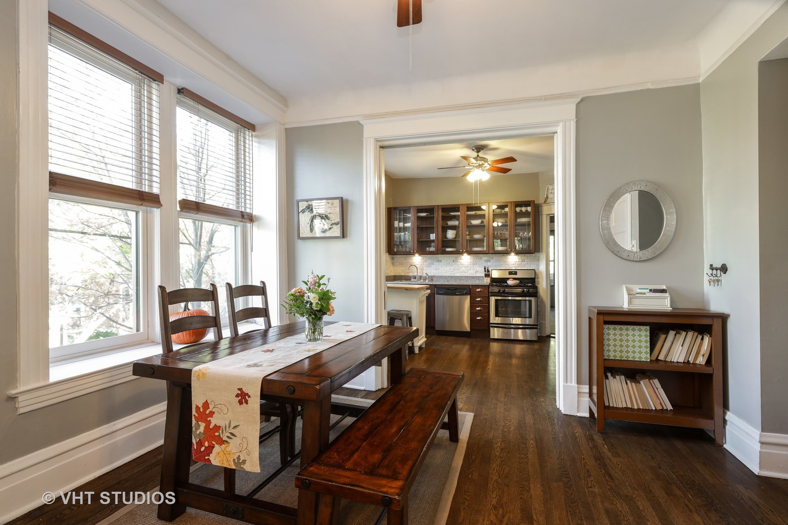 2159 North Seminary Avenue, Unit B Chicago, IL 60614 - Photo 5 of 14 a dining room with wooden floor a glass table and chairs