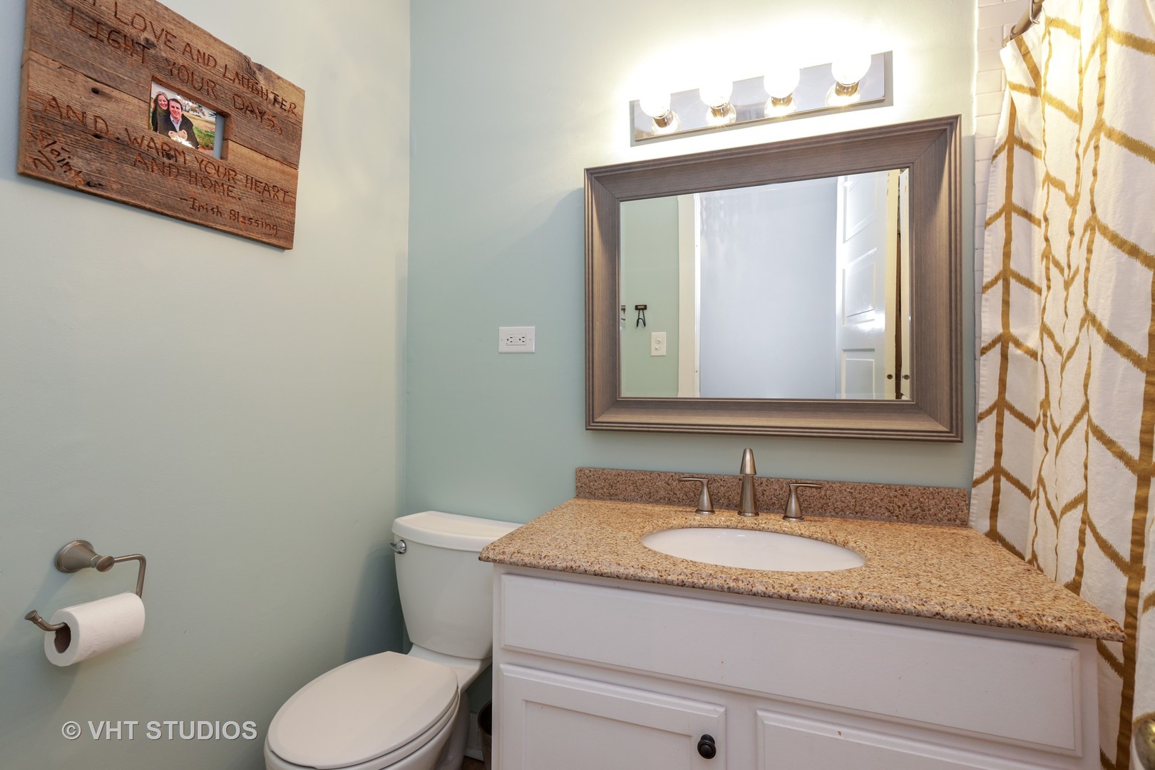 2159 North Seminary Avenue, Unit B Chicago, IL 60614 - Photo 10 of 14 a bathroom with a granite countertop toilet sink and mirror