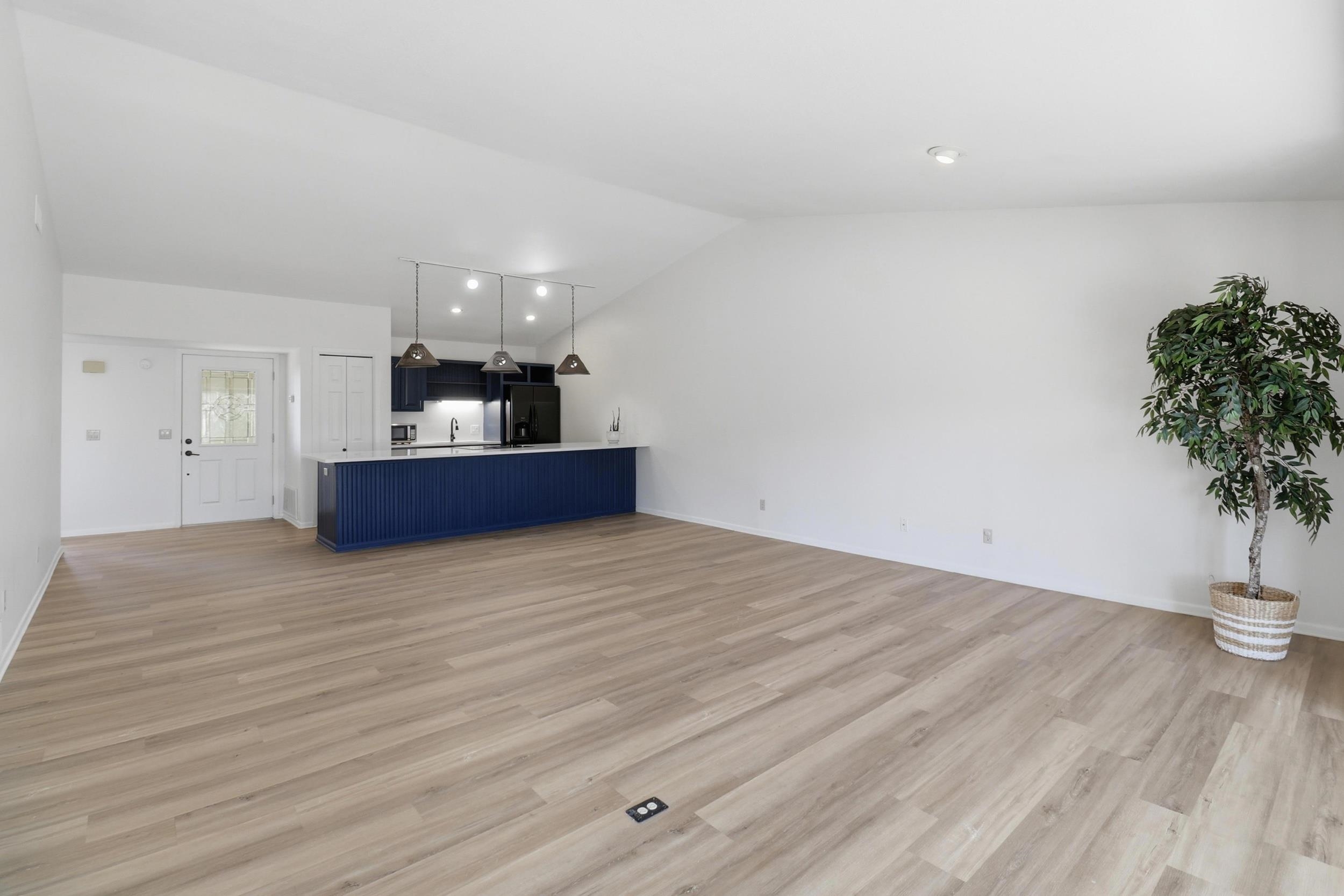 100 Bay Point Drive, Unit 3 Horseshoe Bay, TX 78657 - Photo 8 of 26 a view of kitchen and hall with wooden floor
