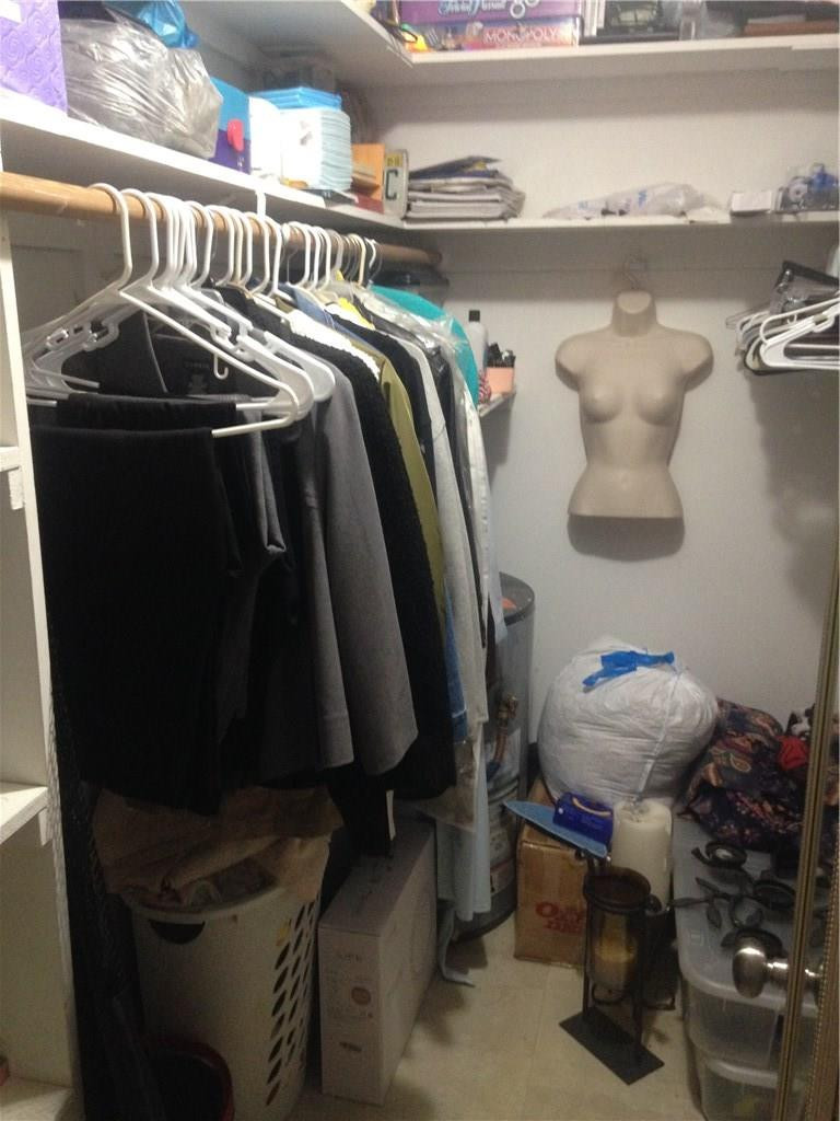 1150 East Sample Road, Unit 107 Pompano Beach, FL 33064 - Photo 5 of 12 a view of walk in closet with clothes and shoes