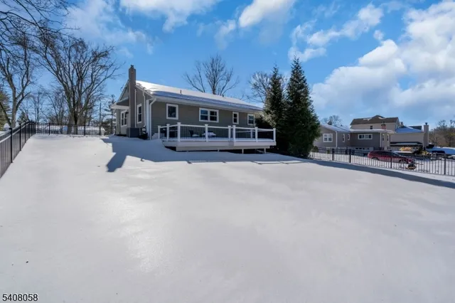 a view of a house with a snow in the yard