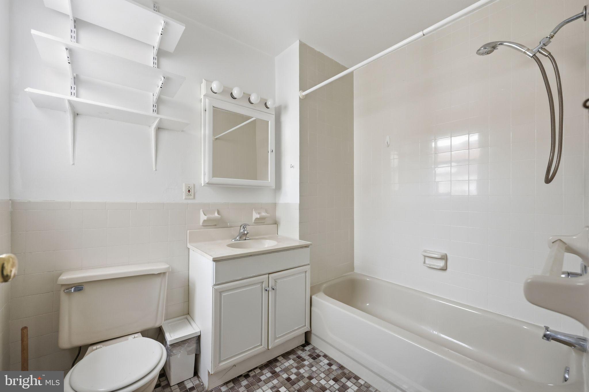 1713 South Street Philadelphia, PA 19146 - Photo 23 of 35 a bathroom with a sink toilet and shower