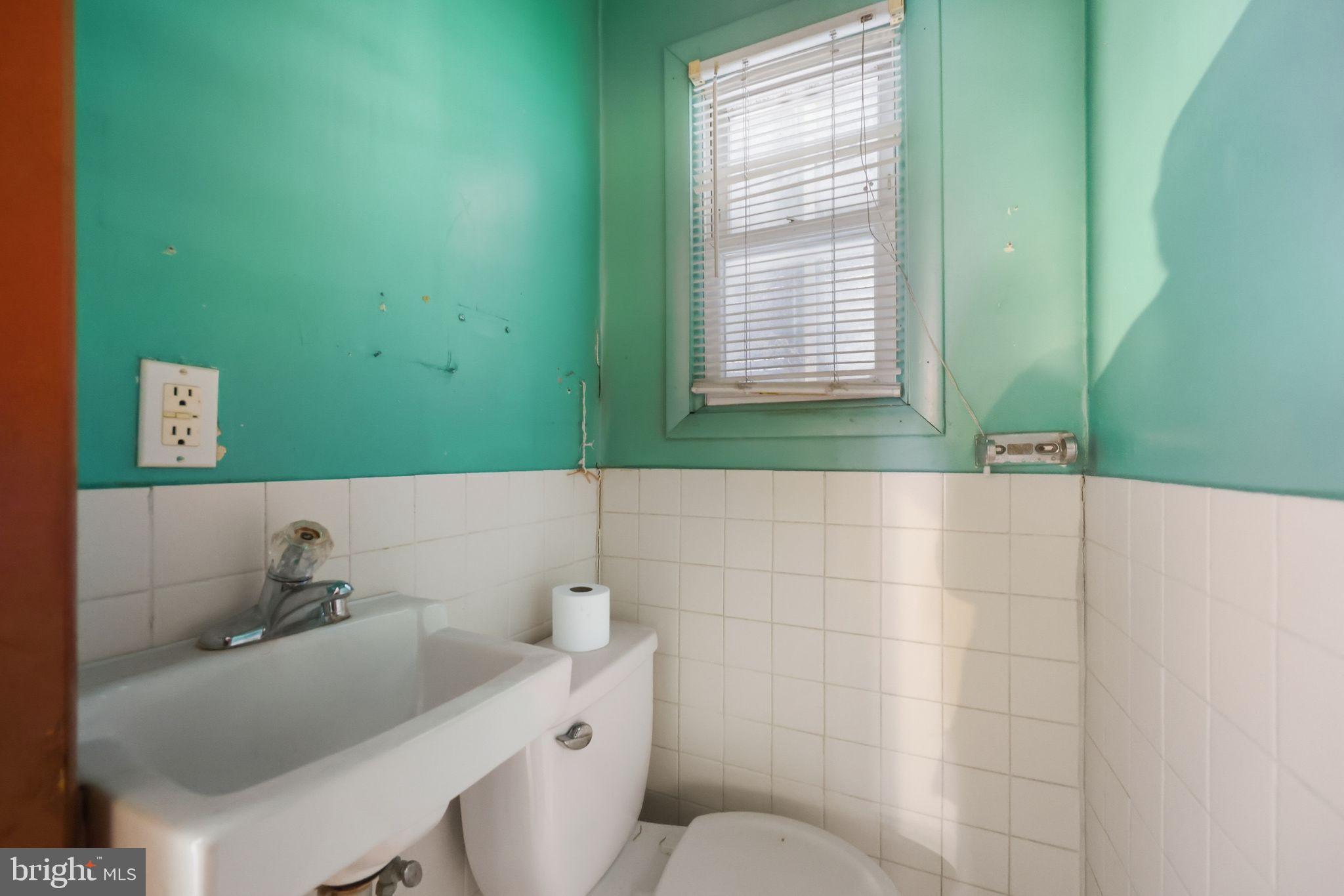 1713 South Street Philadelphia, PA 19146 - Photo 25 of 35 a bathroom with a sink and a toilet