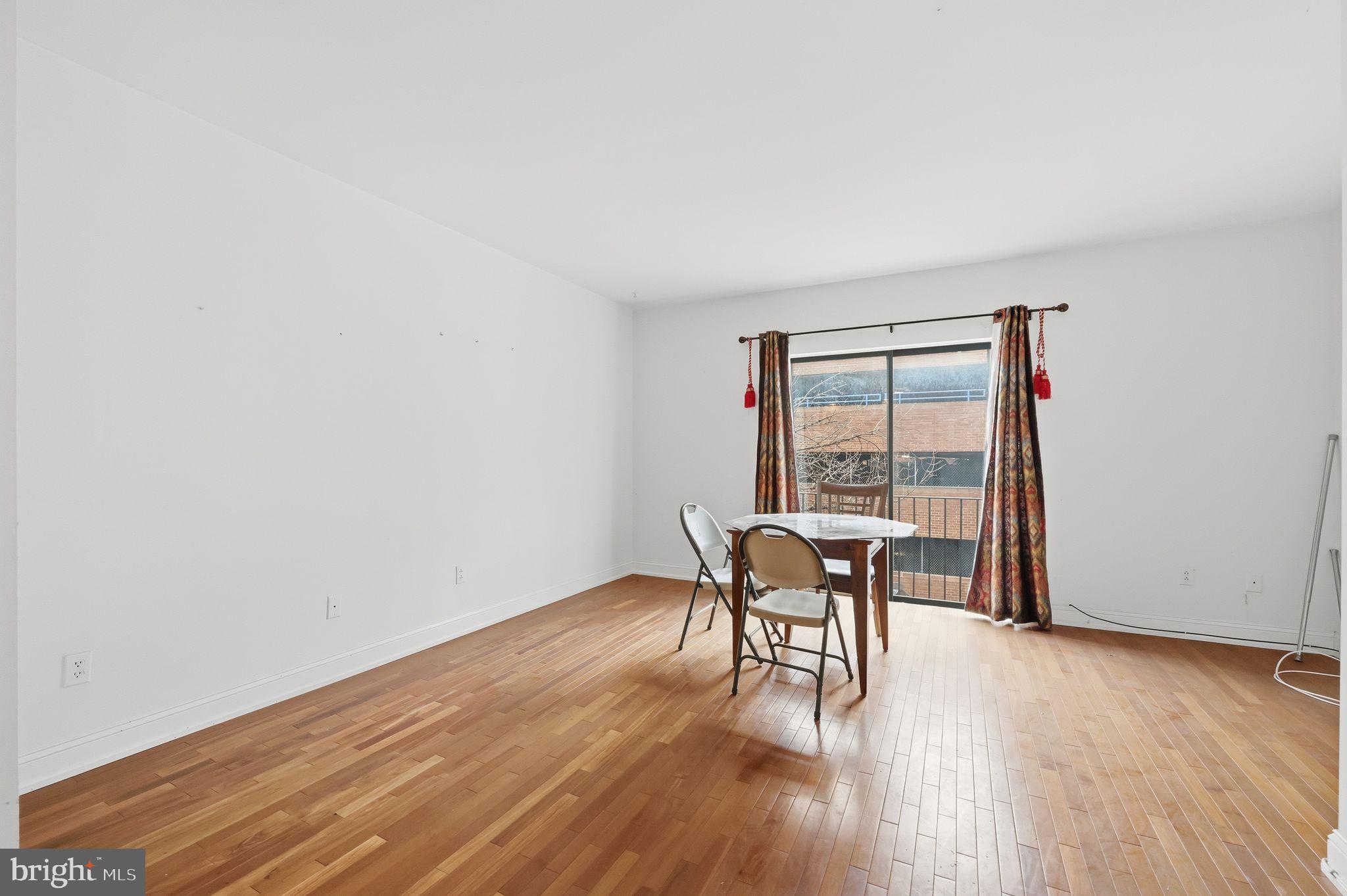 1713 South Street Philadelphia, PA 19146 - Photo 30 of 35 a view of a work space with wooden floor and a floor to ceiling window