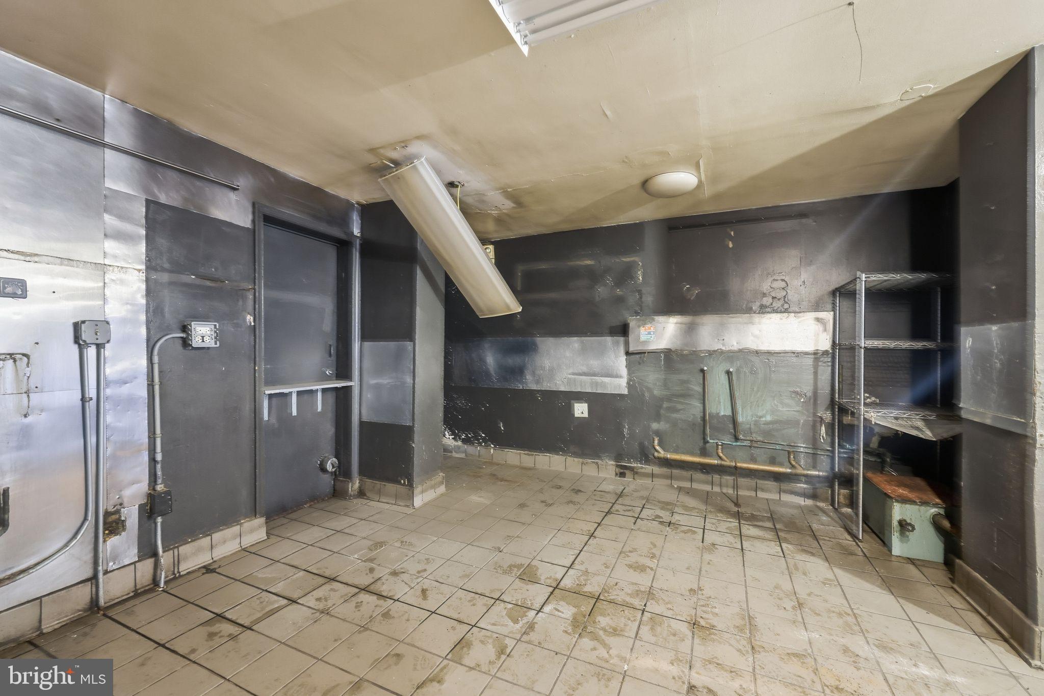 1713 South Street Philadelphia, PA 19146 - Photo 33 of 35 a bathroom with a glass shower door and a sink