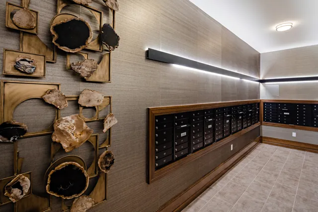 a living room with fireplace furniture and a large window