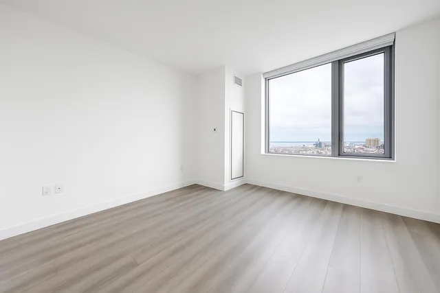 a kitchen with stainless steel appliances a refrigerator sink and cabinets