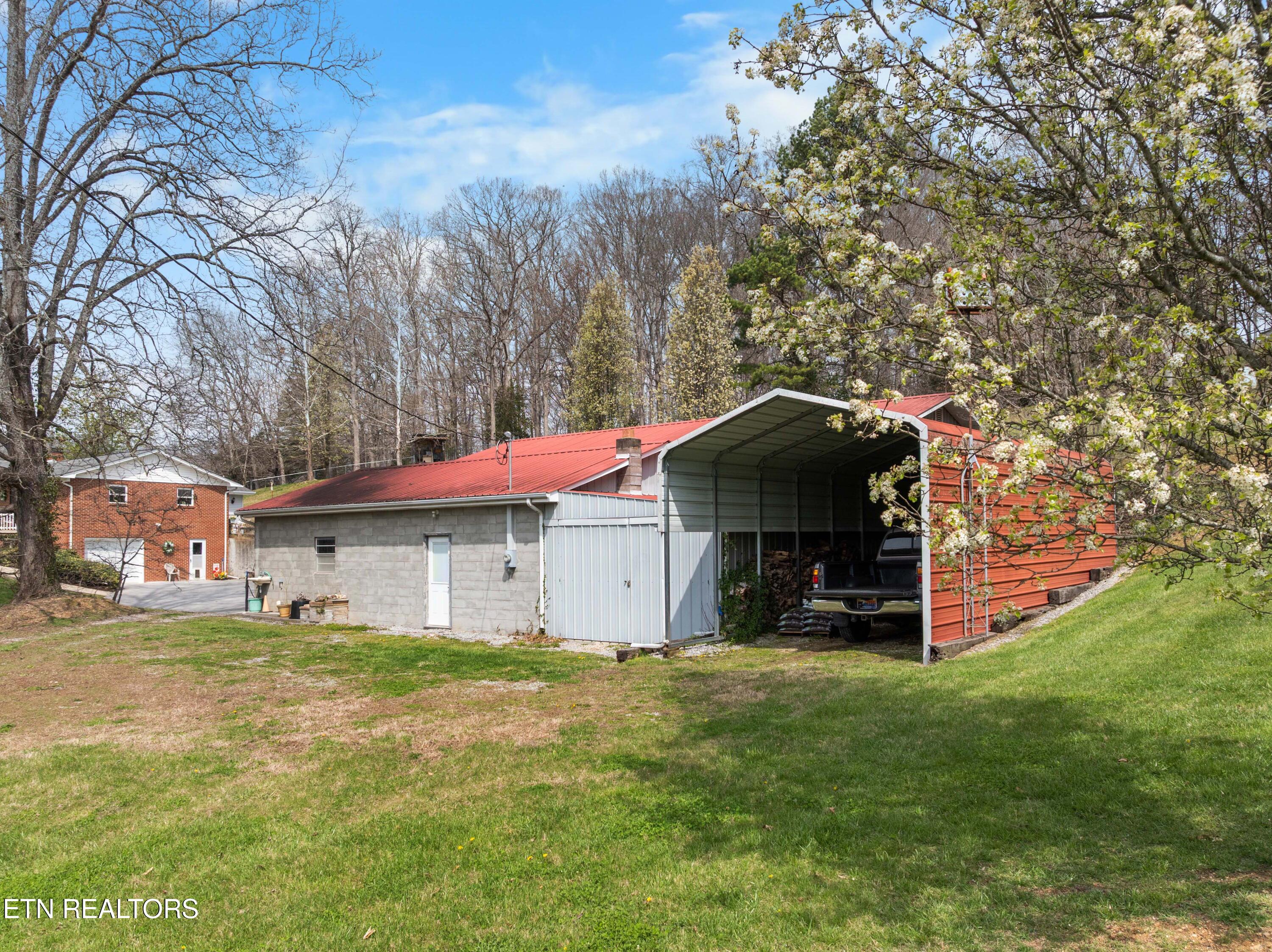 395 Wolfe Road Luttrell, TN 37779 - Photo 3 of 56 TRACTOR CARPORT