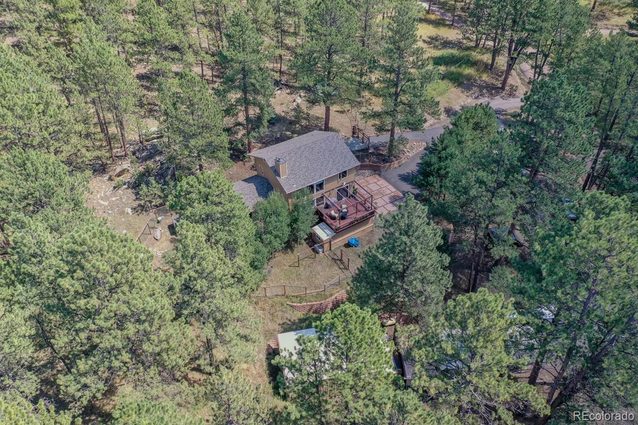 425 Patty Drive Evergreen, CO 80439 - Photo 1 of 43 an aerial view of a house with yard and outdoor seating
