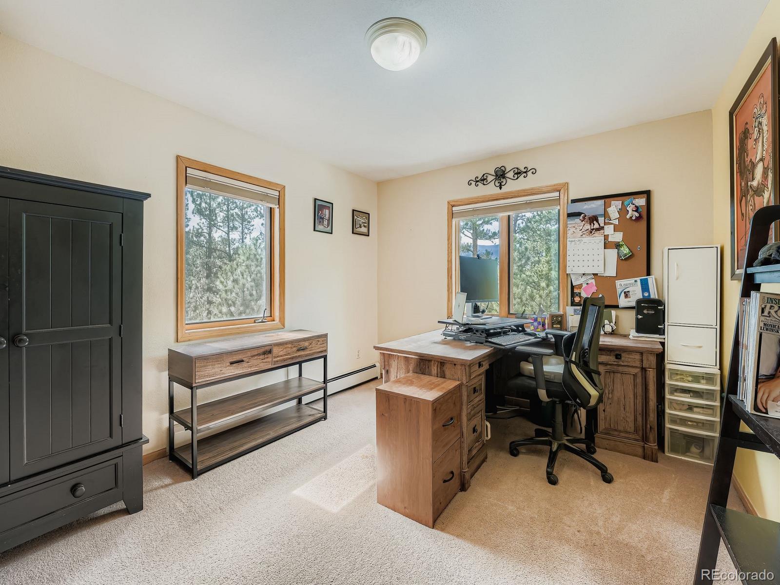 425 Patty Drive Evergreen, CO 80439 - Photo 22 of 43 a view of a workspace with furniture and a window