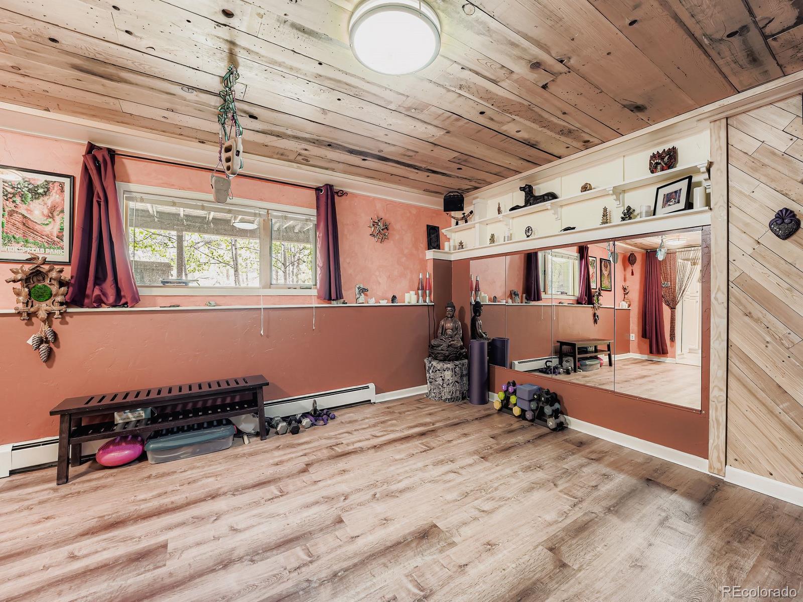 425 Patty Drive Evergreen, CO 80439 - Photo 24 of 43 a room with gym equipment and a window