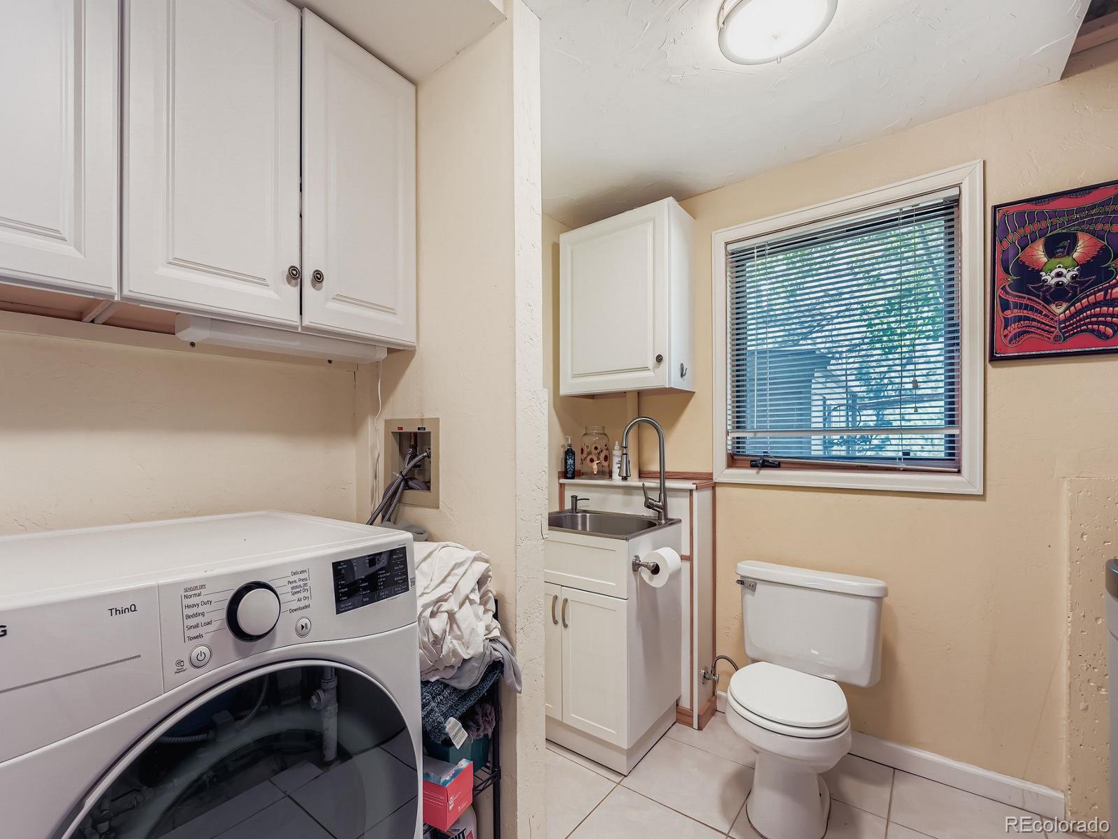 425 Patty Drive Evergreen, CO 80439 - Photo 25 of 43 a utility room with sink dryer and washer