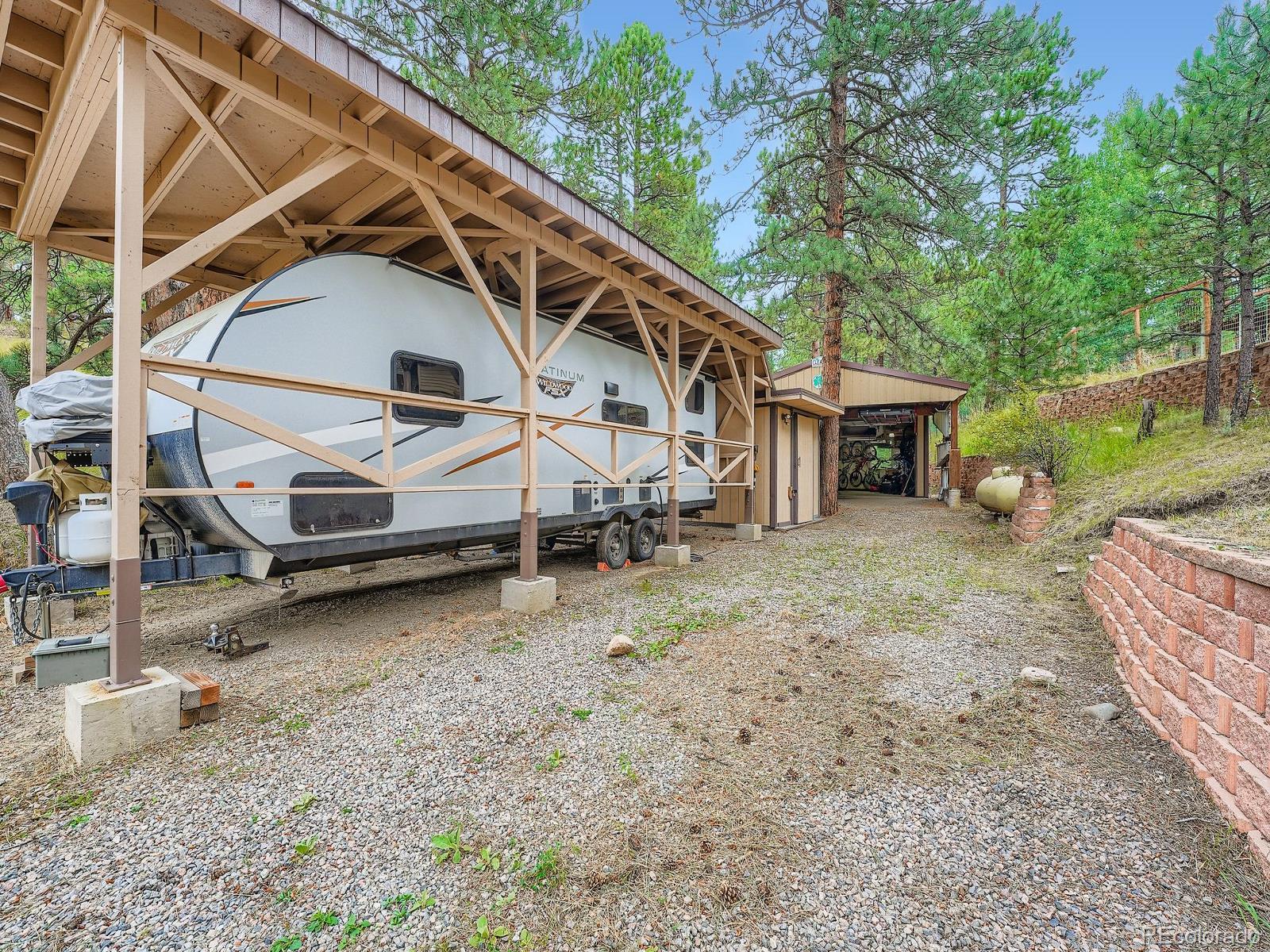 425 Patty Drive Evergreen, CO 80439 - Photo 27 of 43 a view of a house with a yard
