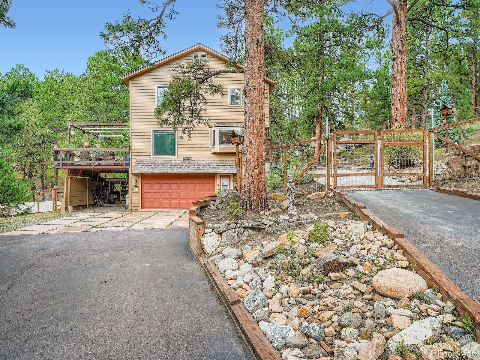 425 Patty Drive Evergreen, CO 80439 - Photo 3 of 43 an outdoor view with patio