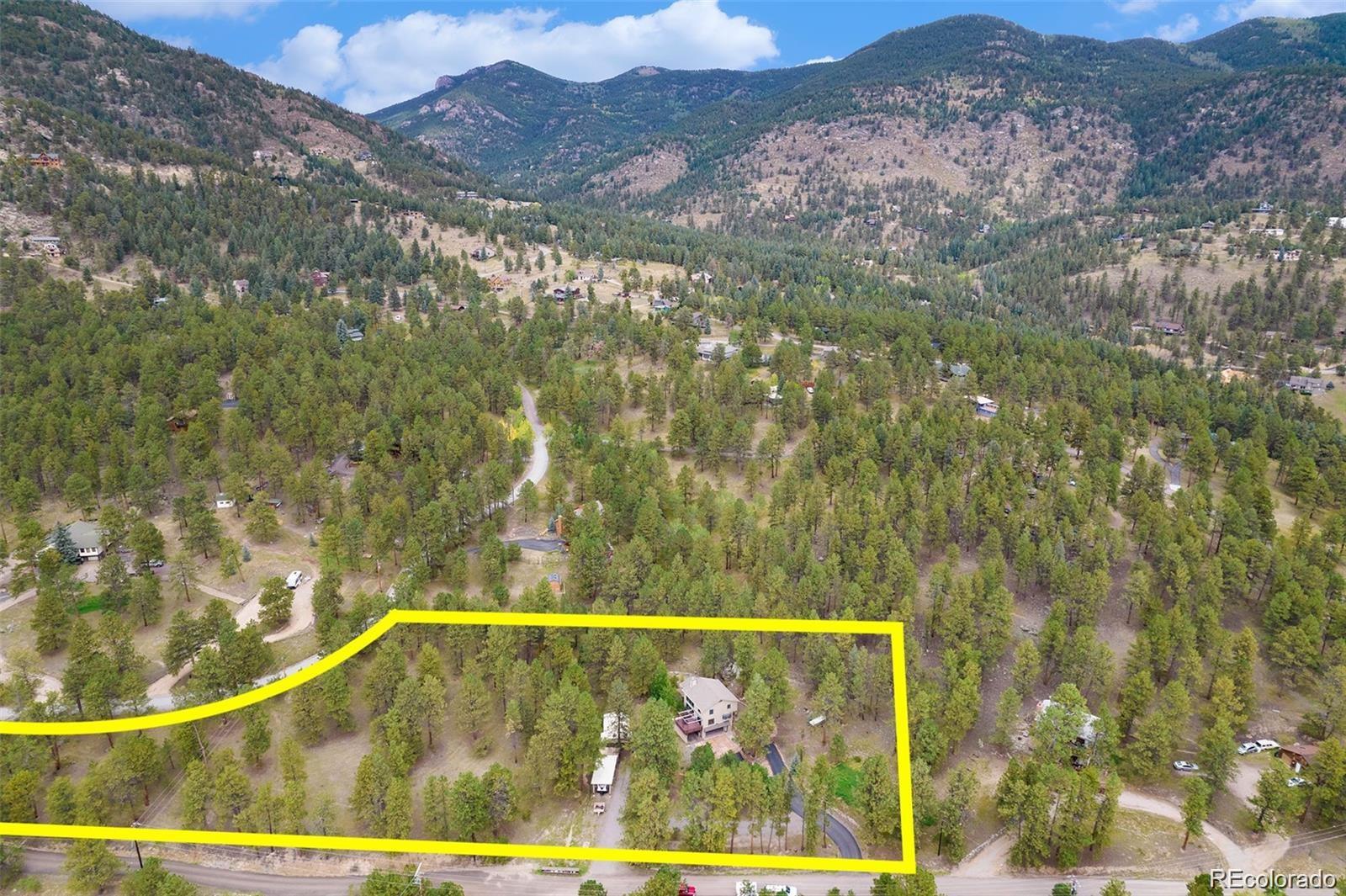 425 Patty Drive Evergreen, CO 80439 - Photo 42 of 43 a view of swimming pool and mountain