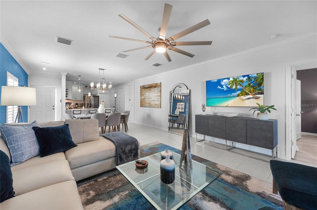 6236 Springmont Loop Palmetto, FL 34221 - Photo 15 of 55 a living room with furniture and a flat screen tv