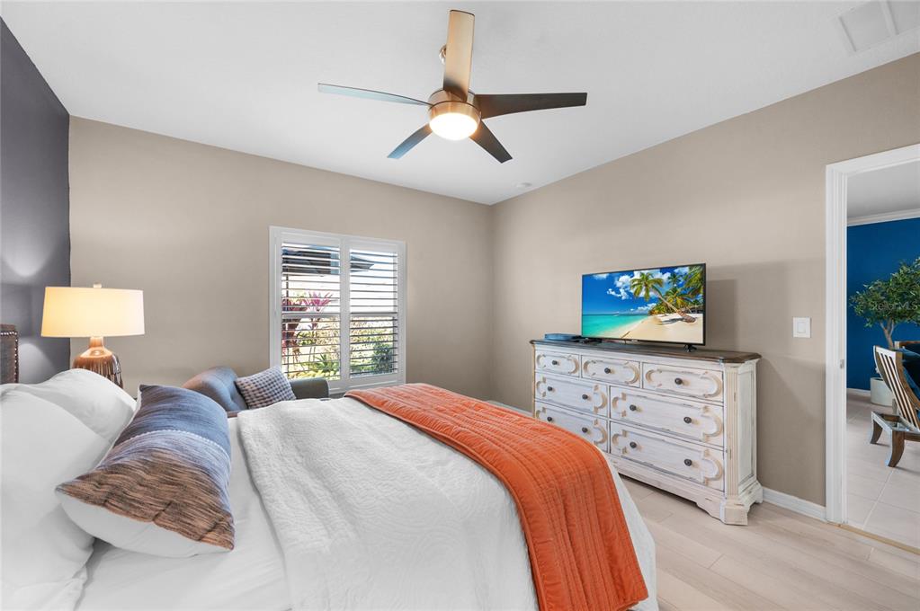 6236 Springmont Loop Palmetto, FL 34221 - Photo 17 of 55 a bedroom with a bed and a dresser