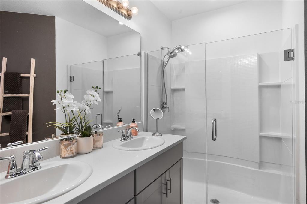 6236 Springmont Loop Palmetto, FL 34221 - Photo 19 of 55 a bathroom with a sink tub shower and a mirror