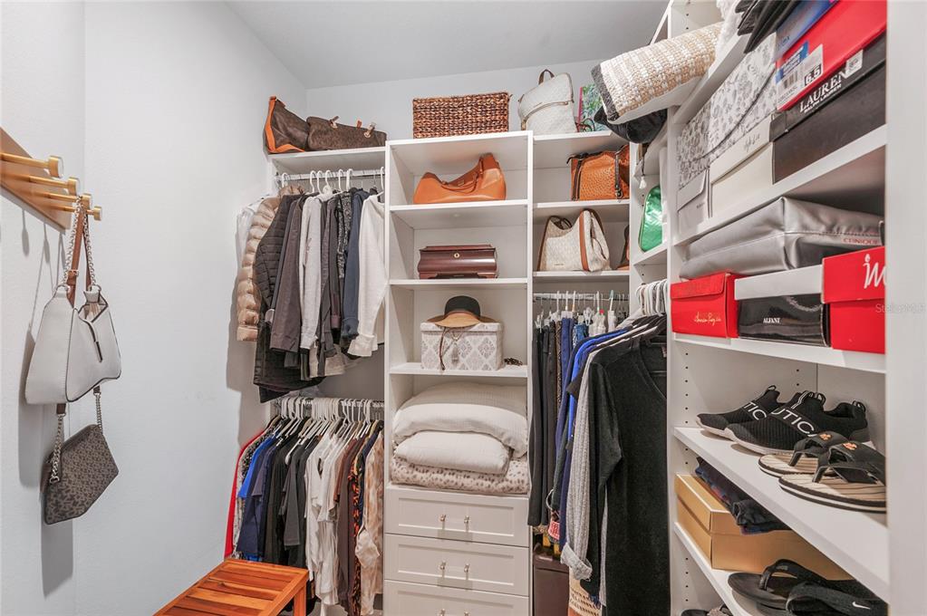 6236 Springmont Loop Palmetto, FL 34221 - Photo 20 of 55 a view of walk in closet with clothes and shoes