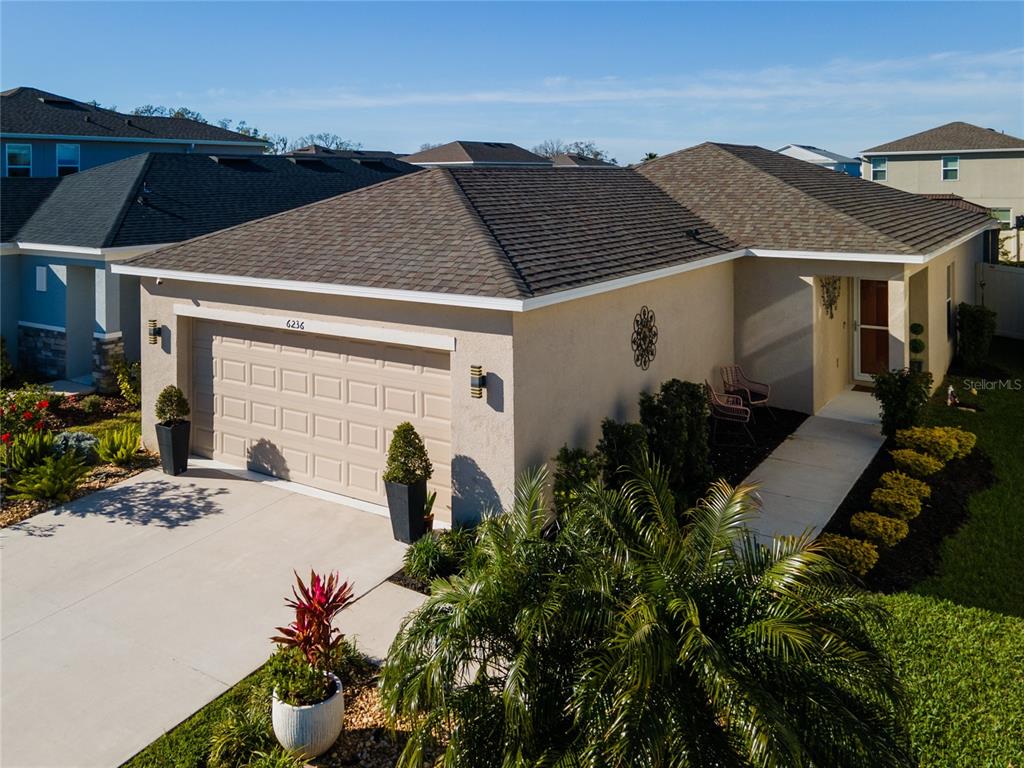 6236 Springmont Loop Palmetto, FL 34221 - Photo 2 of 55 a front view of house with yard