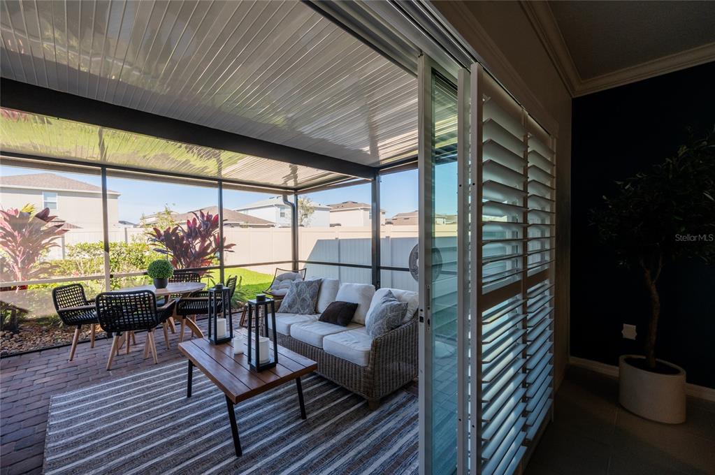 6236 Springmont Loop Palmetto, FL 34221 - Photo 27 of 55 a living room with furniture and floor to ceiling window