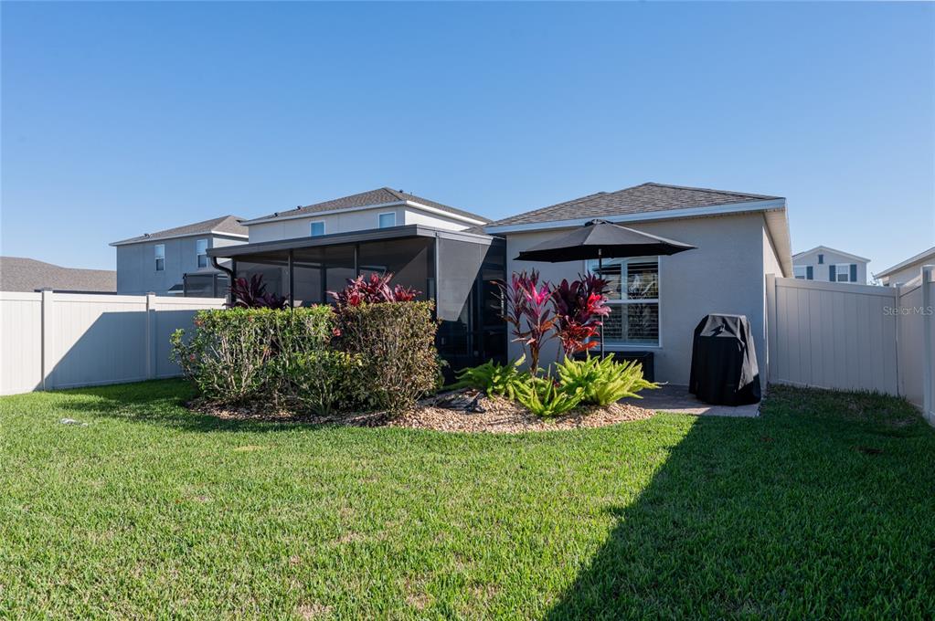 6236 Springmont Loop Palmetto, FL 34221 - Photo 31 of 55 a front view of a house with garden
