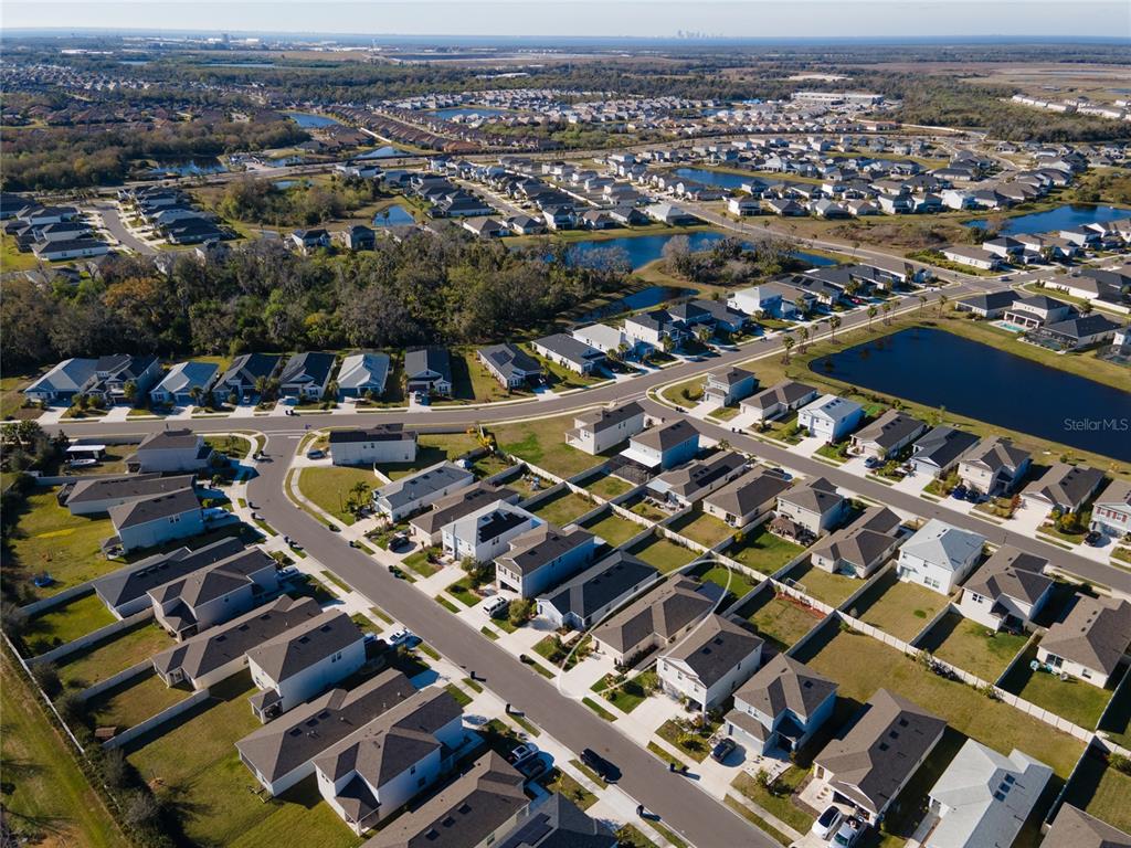 6236 Springmont Loop Palmetto, FL 34221 - Photo 38 of 55 an aerial view of a city with streets and houses