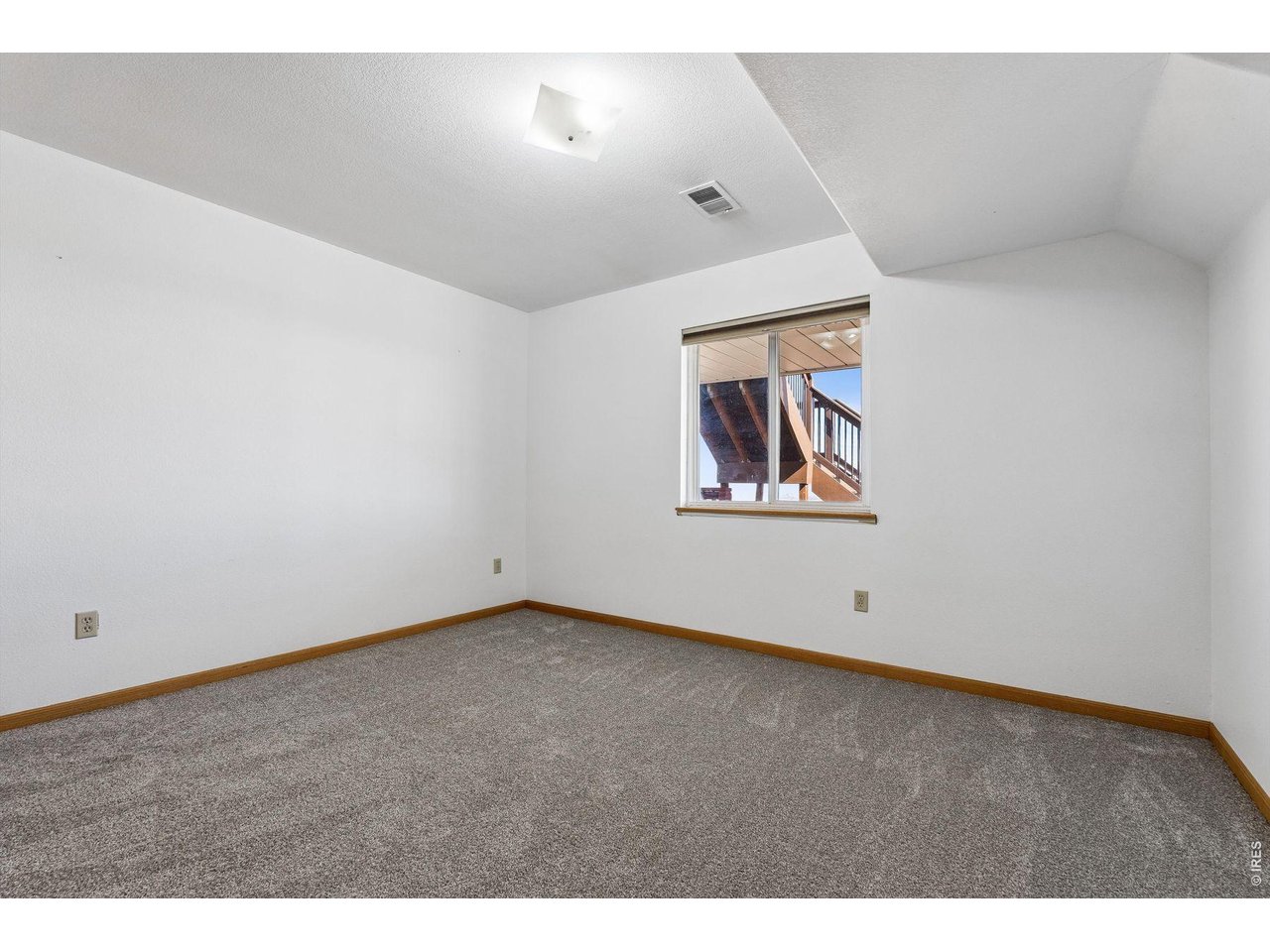 6344 Stag Hollow Road Fort Collins, CO 80526 - Photo 26 of 49 a view of an empty room with a window