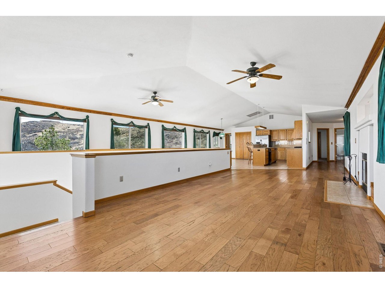 6344 Stag Hollow Road Fort Collins, CO 80526 - Photo 10 of 49 a view interior of a house with wooden floor and windows