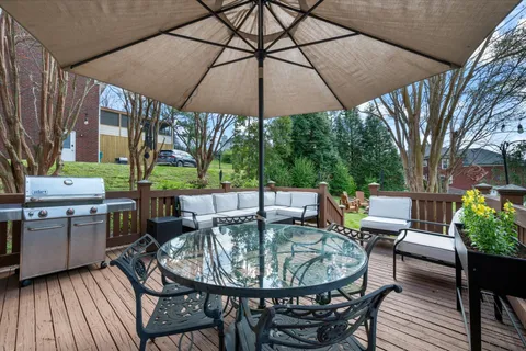 a patio with a patio table and chairs