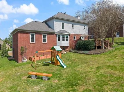 a house that has a big yard in front of it