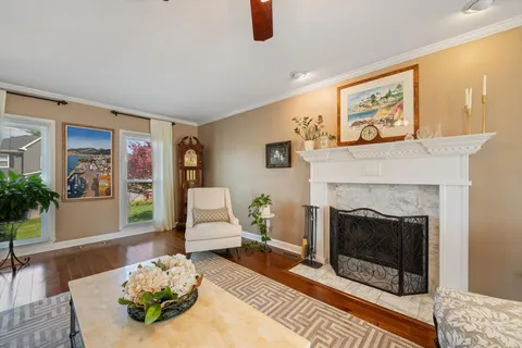 a living room with furniture and a fireplace