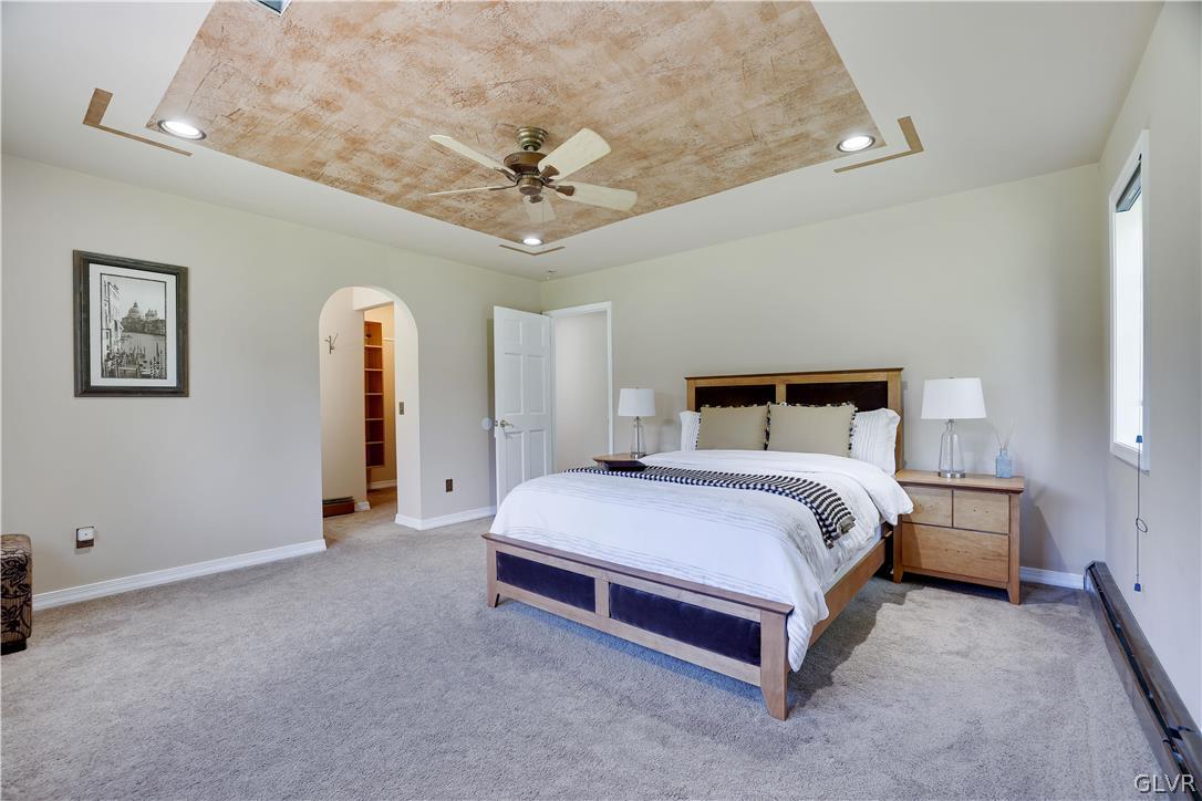 2285 Green Road Tobyhanna, PA 18466 - Photo 24 of 42 a bedroom with a bed and a chandelier
