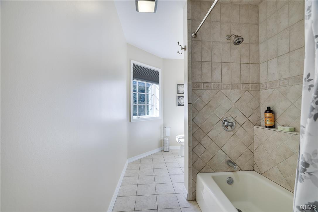 2285 Green Road Tobyhanna, PA 18466 - Photo 27 of 42 a bathroom with a bathtub and a shower