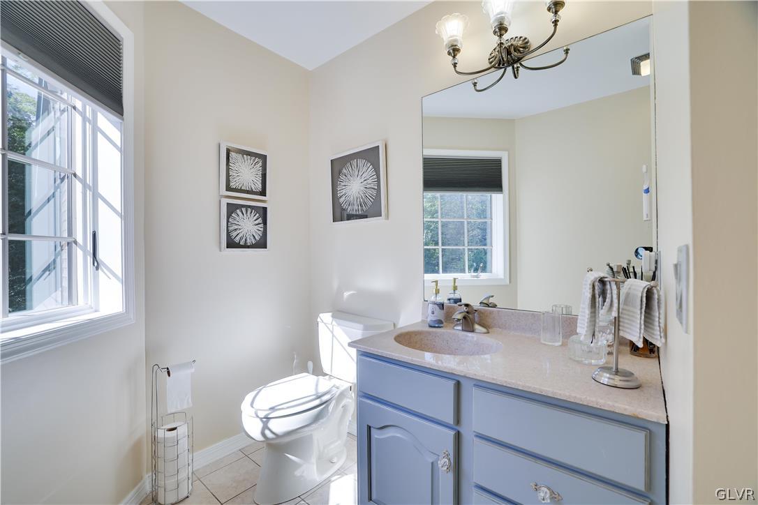 2285 Green Road Tobyhanna, PA 18466 - Photo 28 of 42 a bathroom with a sink a toilet and mirror