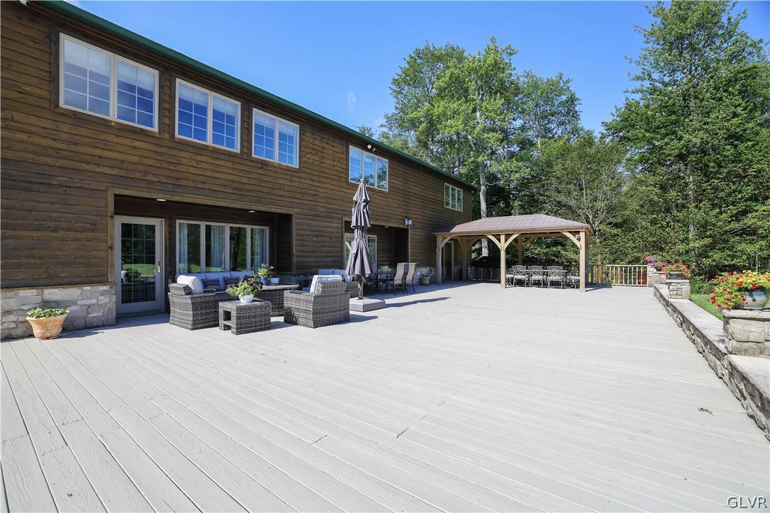 2285 Green Road Tobyhanna, PA 18466 - Photo 33 of 42 a view of a house with sitting area and view of a swimming pool