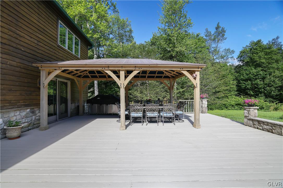 2285 Green Road Tobyhanna, PA 18466 - Photo 35 of 42 a view of patio with table and chairs under an umbrella