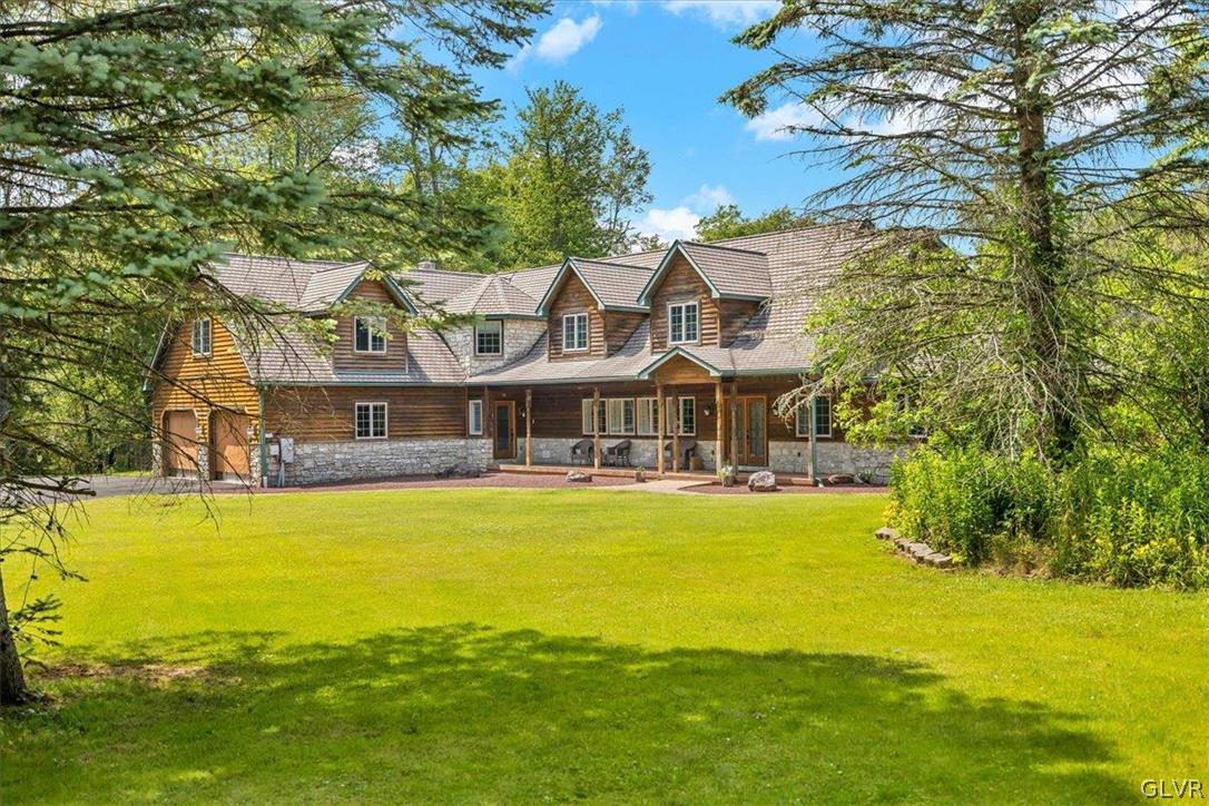2285 Green Road Tobyhanna, PA 18466 - Photo 4 of 42 a front view of a house with swimming pool and a yard
