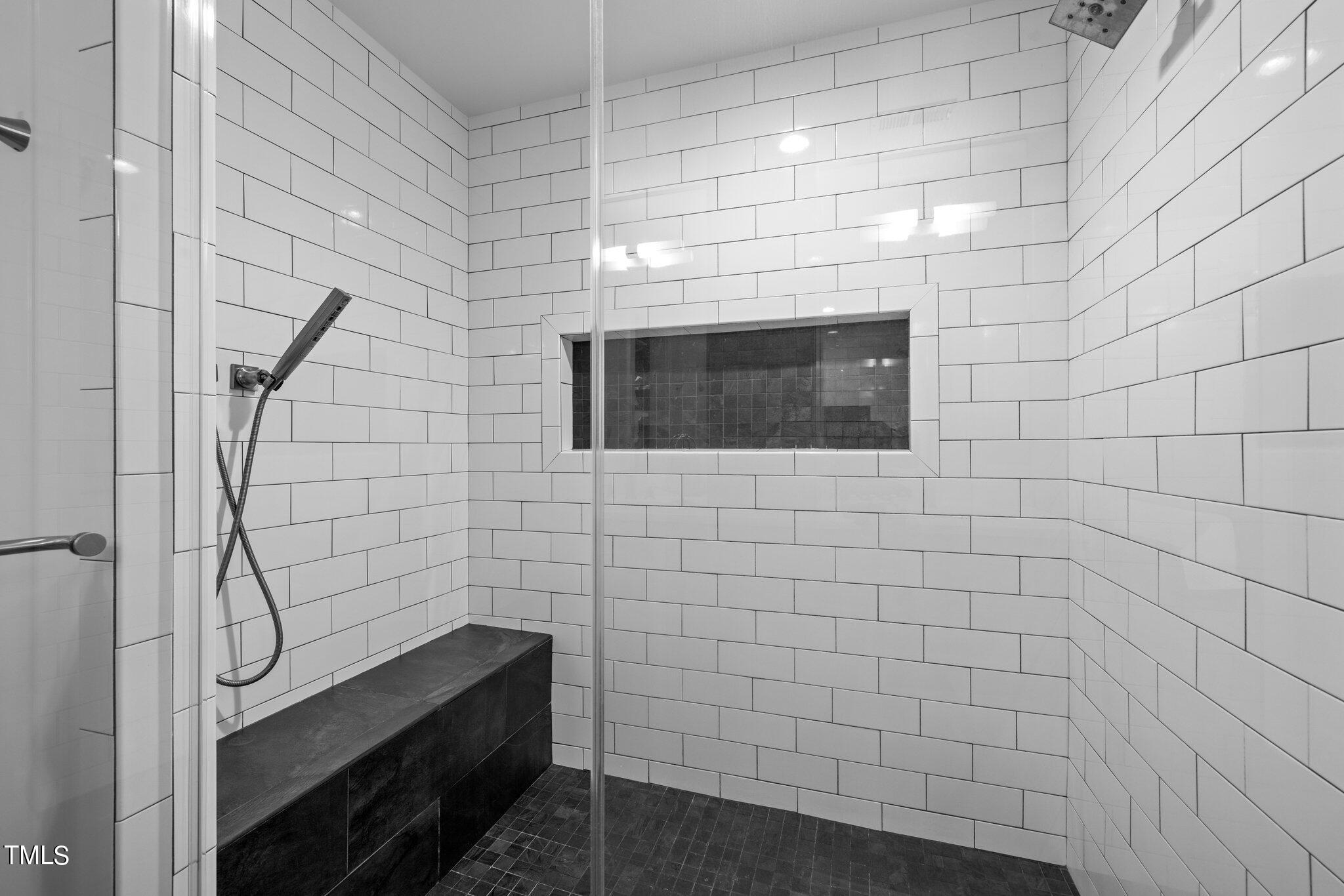 1110 Dogwood Lane Raleigh, NC 27607 - Photo 14 of 46 6' shower with zero entry, bench and frameless glass door