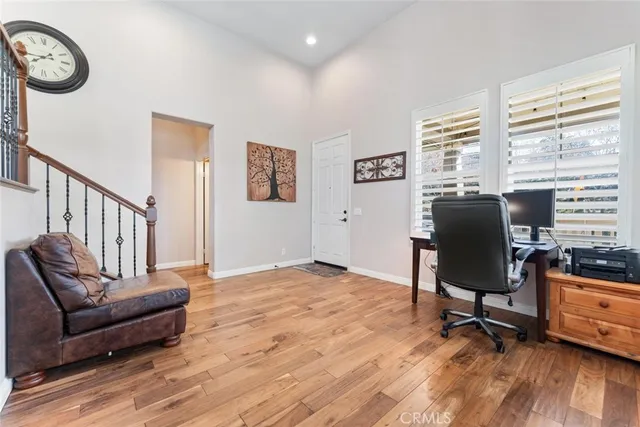 a front view of a house with a garden and plants
