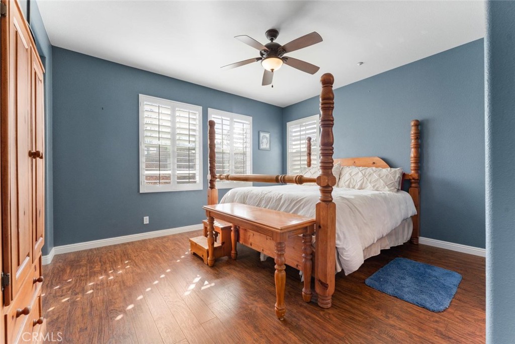 22 Arlington Street Ladera Ranch, CA 92694 - Photo 27 of 51 a bedroom with a bed and a ceiling fan