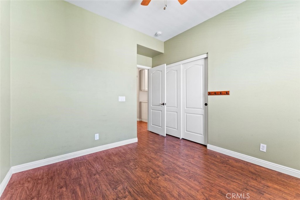 22 Arlington Street Ladera Ranch, CA 92694 - Photo 32 of 51 an empty room with wooden floor and closet