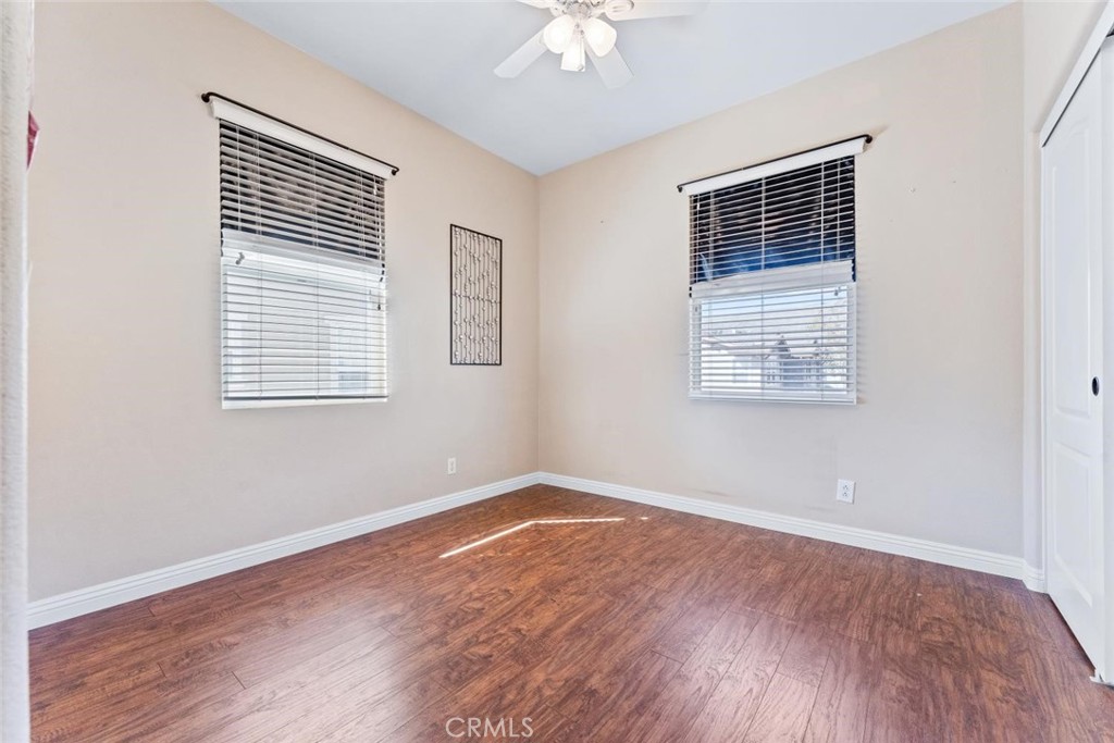 22 Arlington Street Ladera Ranch, CA 92694 - Photo 34 of 51 a view of an empty room with wooden floor and a window