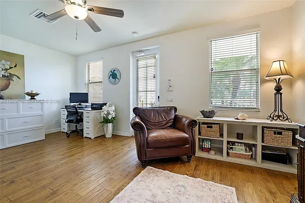 a living room with furniture and windows