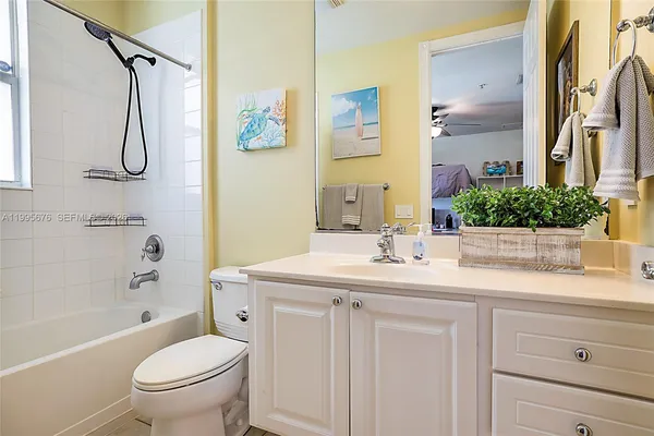 a bathroom with a sink double vanity and a shower