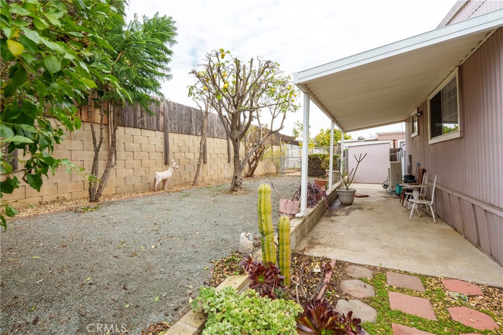 4000 Pierce Street, Unit 72 Riverside, CA 92505 - Photo 18 of 20 a backyard of a house with table and chairs