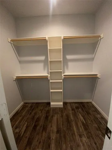 a storage room with wooden floor